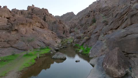 Rocky Desert Mountain Valley Stream Drone Aerial Footage