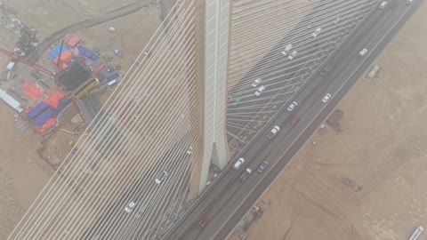 The suspended bridge in Wadi Laban in the city of Riyadh, the roads and streets with traffic in the Kingdom of Saudi Arabia.