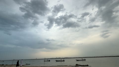 Fishing Boats on Coast under Cloudy Sunset Sky