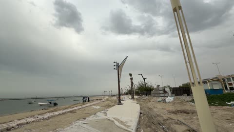 Coastal Promenade Construction Under Stormy Sky