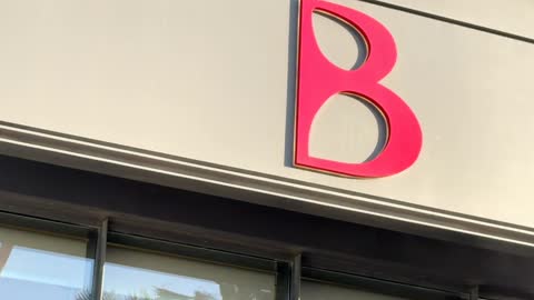 Pink Letter B Logo on Modern Building Exterior Footage