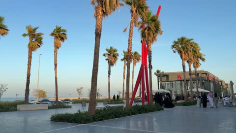 People Walking on Coastal Promenade Saudi Arabia