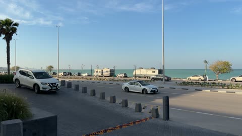 Coastal Road Traffic and Waterfront RV Parking Video