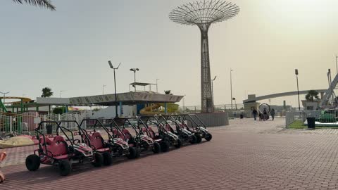 Four-wheel drive vehicles are parked in the waterfront park.