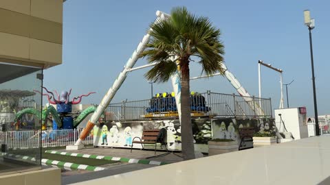 Amusement Park Entrance Sign and Rides Daylight