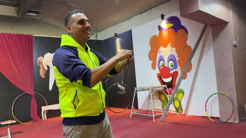 Magician Practicing Metal Ring Trick Indoor Rehearsal