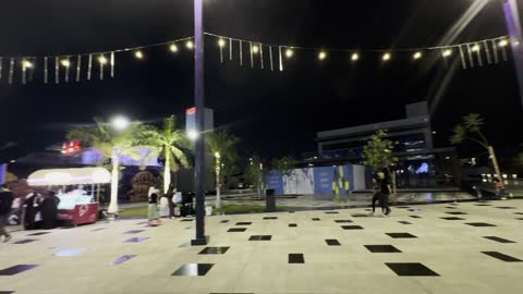 People Walking in Modern Night Plaza Footage