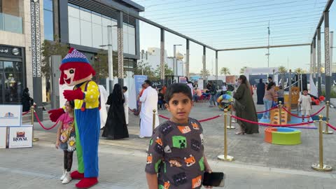 Children Interacting with Mascot at Outdoor Event