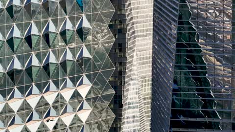 Modern Skyscraper Geometric Glass Facade Panning Shot