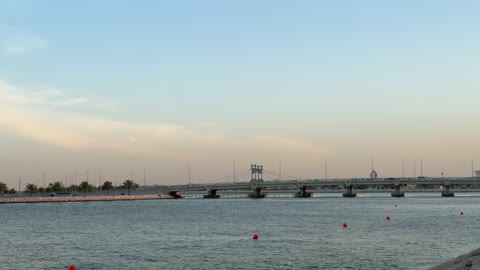 Coastal Bridge and Waterway During Evening Sunset