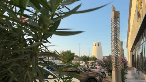Traditional Tower and Modern Parking Lot Daylight Video