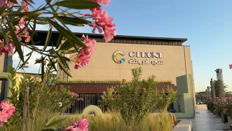 C Front Building Exterior with Pink Flowers Footage