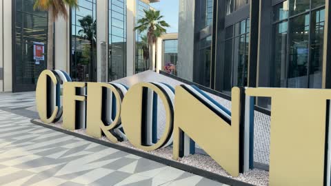 Modern Shopping Mall Entrance Gold Sign Exterior