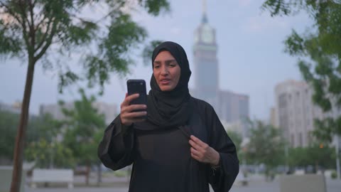 Arab Woman Using Smartphone in Makkah Saudi Arabia Park