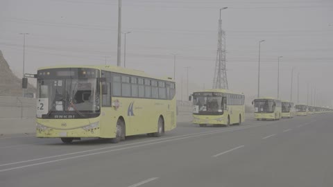Yellow Hajj Buses Saudi Arabia Highway Convoy Footage