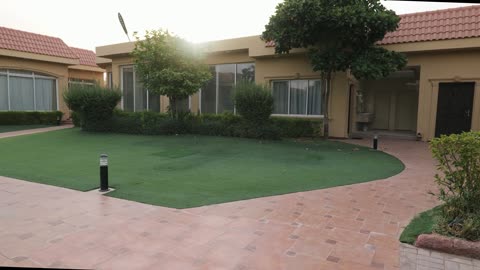 Modern Residential Villa Garden and Walkway Daytime