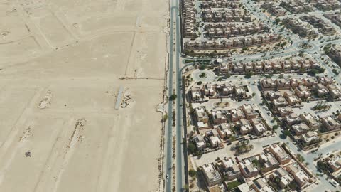 Aerial View of Residential Development and Desert Land
