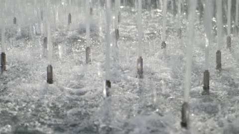 Ground Level Water Fountain Jets Daylight Video