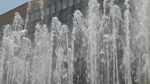 Water Fountain Spraying Outside Modern City Building
