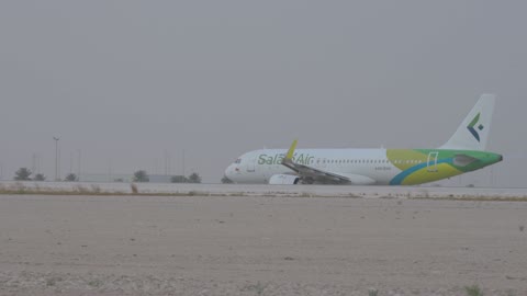 SalamAir Airbus A320neo Taxiing on Airport Runway
