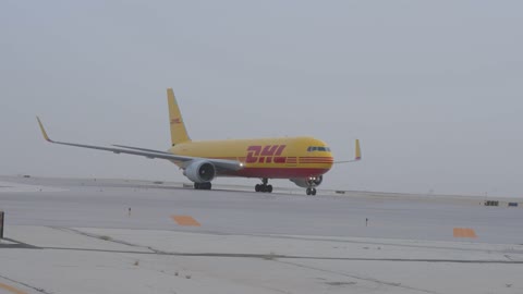 DHL Cargo Airplane Taxiing on Airport Runway