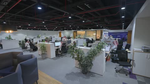 Saudi Professionals Working in Modern Open Plan Office