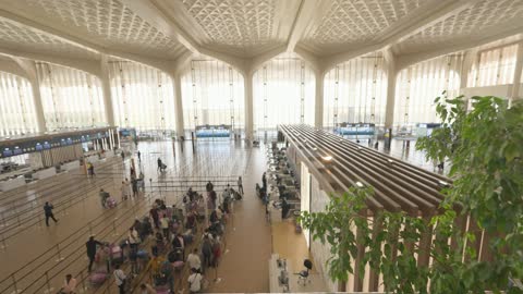 Modern Airport Terminal Check-in Counters and Passengers