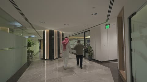 Saudi Businessman Walking in Modern Corporate Office