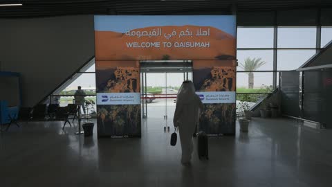 Saudi Man Walking Through Qaisumah Airport Arrival Gate