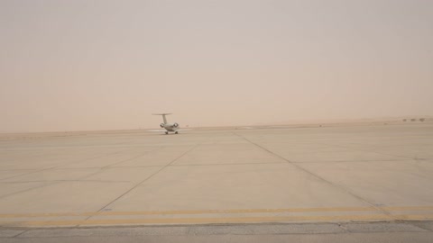 Private Jet on Desert Runway During Sandstorm
