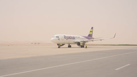 Flyadeal Airplane Taxiing in Desert Sandstorm Footage
