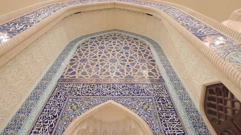 Islamic Calligraphy and Blue Tile Mosque Interior