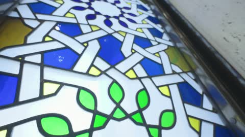 Islamic Stained Glass Window with Geometric Patterns
