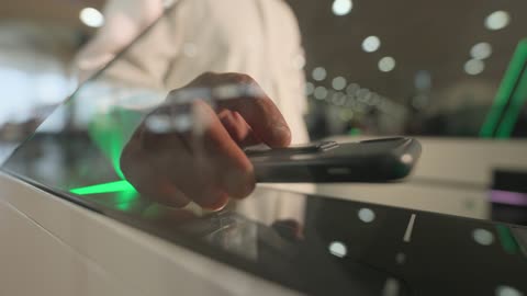 Man Scanning QR Code at Electronic Gate Close Up
