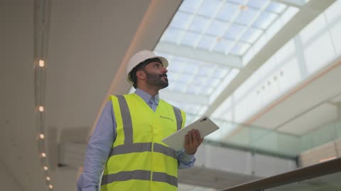 Arab Engineer With Tablet Inspecting Modern Building