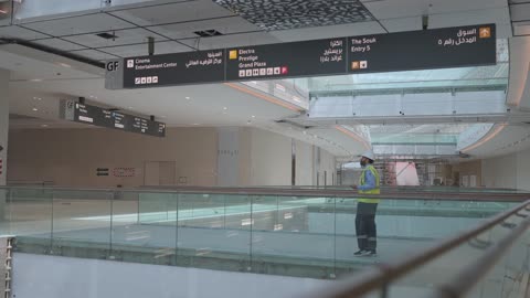 Construction Worker Walking In Modern Mall Interior Video