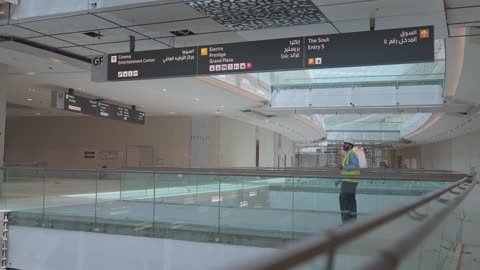 Construction Supervisor Inspecting Modern Shopping Mall Interior