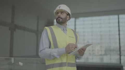 Arab Engineer Construction Site Digital Tablet Inspection