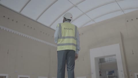 Engineer Inspecting Large Hall Interior Architecture