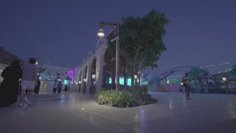 People Walking in Outdoor Pedestrian Mall at Night