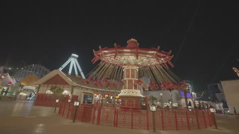 Amusement Park Swing Ride Rotating at Night