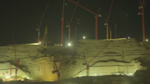 Industrial Construction Site Night Work with Cranes
