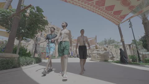 Saudi Men Walking in Water Park Tracking Shot