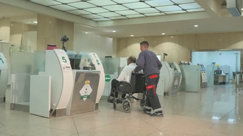 Senior Wheelchair Passenger at Saudi Airport Immigration