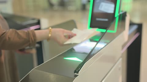 Passenger Scanning Boarding Pass at Airport Gate