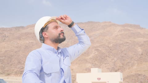 Arab Engineer Riding Electric Scooter Near Mountain Site