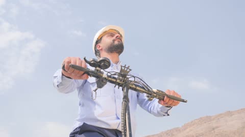 Saudi Technician Riding Electric Scooter Industrial Site