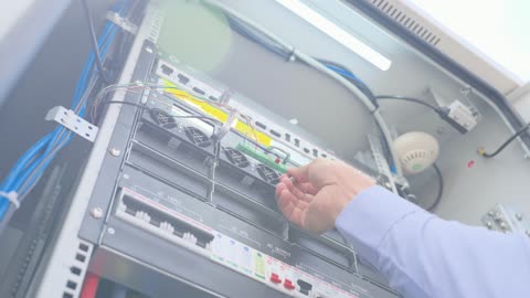 Technician Installing Server Rack Hardware Module