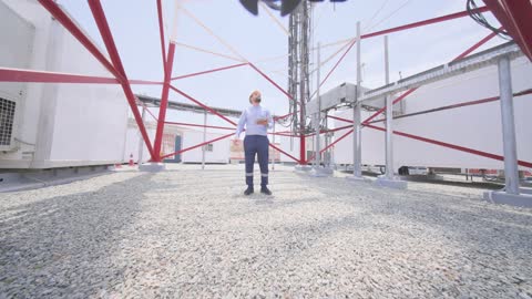 Arab Telecom Engineer Inspecting Cell Tower Site