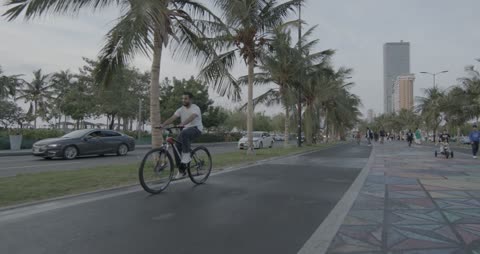 Man Riding Bicycle on Jeddah Corniche Coastal Track